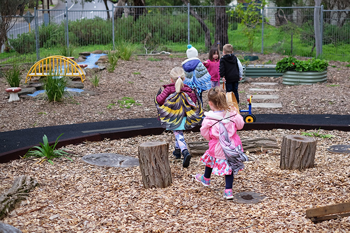 children playing outside at kindy